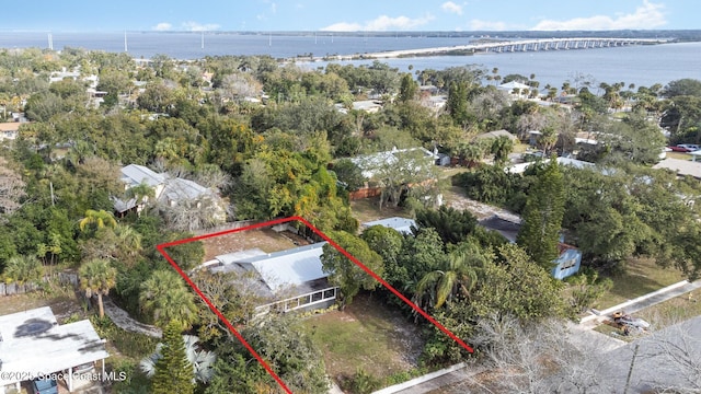 406 Mcleod Dr, Cocoa, FL 32922 - aerial view of property's location with a notable bridge, property parcel outlined, and a nearby body of water