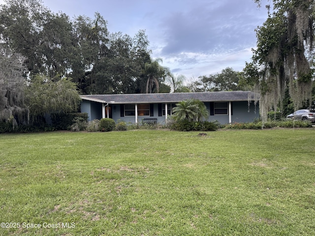 3054 Knox Mcrae Dr, Titusville, FL 32780 - single story home featuring a front yard and stucco siding