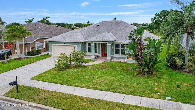 2542 Woodfield Cir, Melbourne, FL 32904 - ranch-style home with a garage, stucco siding, driveway, and a front lawn