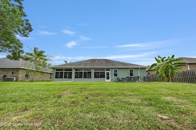 2542 Woodfield Cir, Melbourne, FL 32904 - back of property with a sunroom and stucco siding