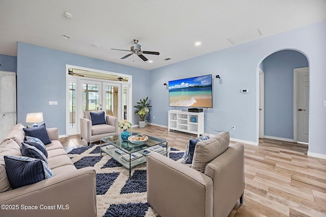 2542 Woodfield Cir, Melbourne, FL 32904 - living room with arched walkways, wood finished floors, a ceiling fan, and recessed lighting