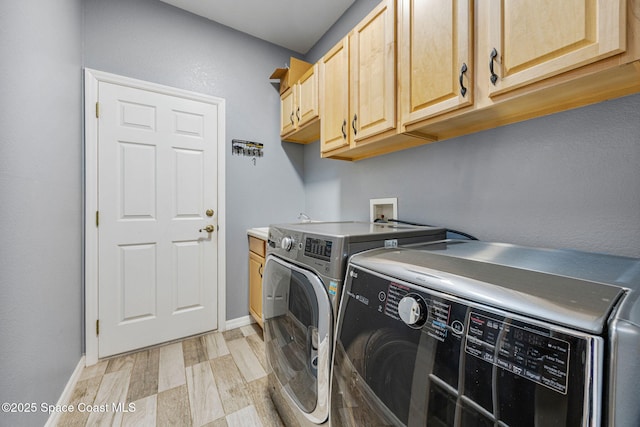2542 Woodfield Cir, Melbourne, FL 32904 - laundry room featuring washer and clothes dryer and cabinet space