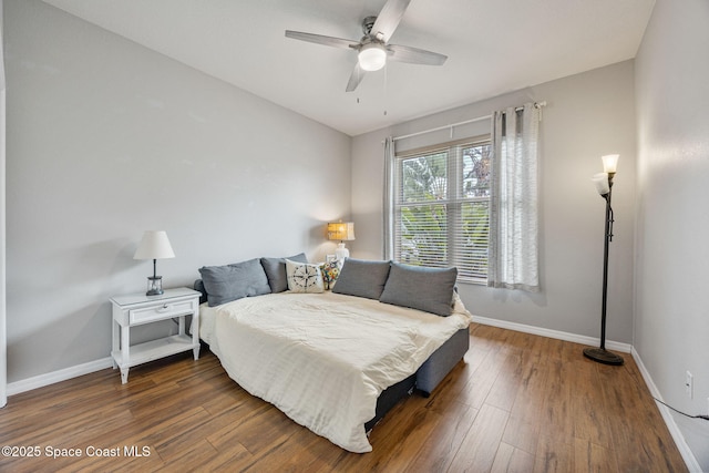 2542 Woodfield Cir, Melbourne, FL 32904 - bedroom with wood finished floors and ceiling fan