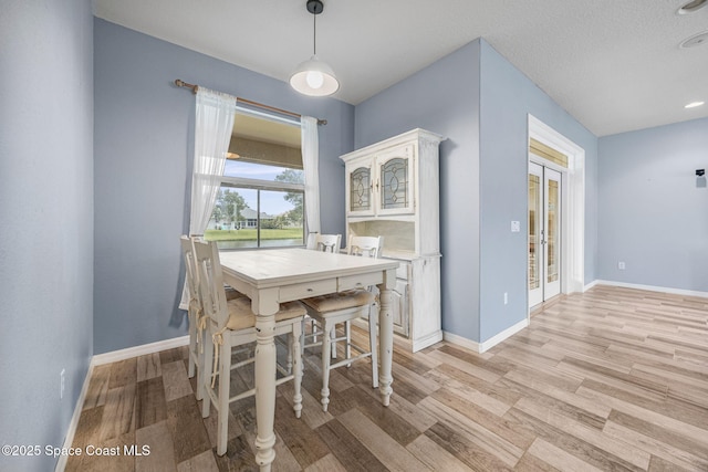 2542 Woodfield Cir, Melbourne, FL 32904 - dining room featuring light wood-style flooring and recessed lighting