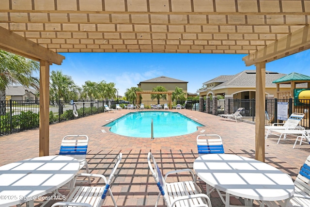 6586 Split Rail Ln, Cocoa, FL 32927 - community pool featuring a patio area and outdoor dining space