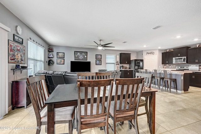 6586 Split Rail Ln, Cocoa, FL 32927 - dining space with healthy amount of natural light, ceiling fan, light tile patterned floors, and recessed lighting