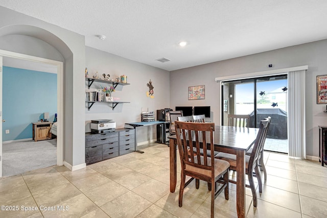6586 Split Rail Ln, Cocoa, FL 32927 - dining space with light tile patterned flooring and a textured ceiling