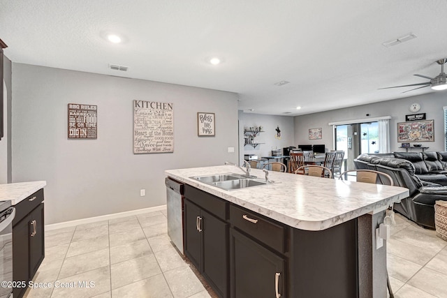 6586 Split Rail Ln, Cocoa, FL 32927 - kitchen with open floor plan, stainless steel dishwasher, light countertops, a ceiling fan, and an island with sink