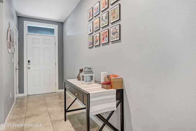 6586 Split Rail Ln, Cocoa, FL 32927 - entryway with light tile patterned flooring and baseboards