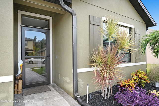 6586 Split Rail Ln, Cocoa, FL 32927 - property entrance featuring stucco siding