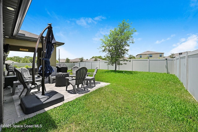6586 Split Rail Ln, Cocoa, FL 32927 - fenced backyard with a patio area