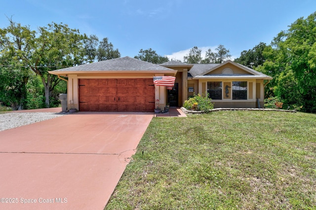 5505 95th St, Sebastian, FL 32958 - view of front of house with a garage, driveway, a front yard, and stucco siding