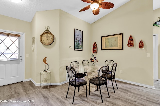5505 95th St, Sebastian, FL 32958 - dining room featuring wood finished floors, a ceiling fan, and vaulted ceiling
