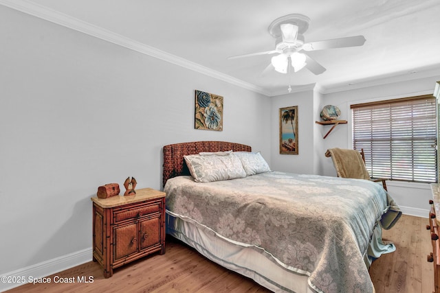 5505 95th St, Sebastian, FL 32958 - bedroom featuring ornamental molding, light wood-style flooring, and ceiling fan