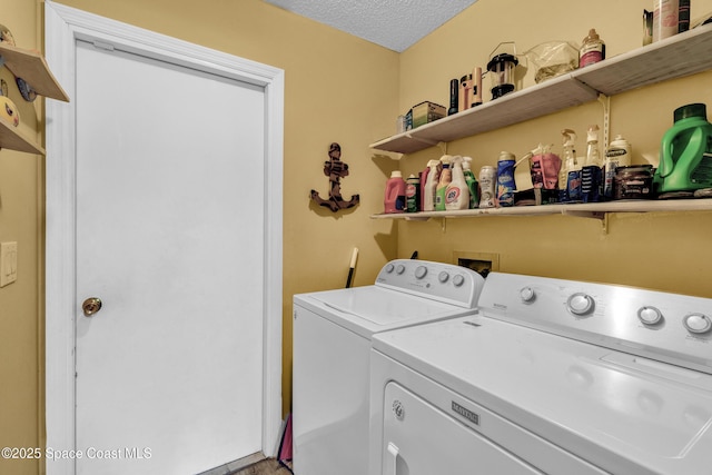 5505 95th St, Sebastian, FL 32958 - laundry room with washer and clothes dryer and a textured ceiling