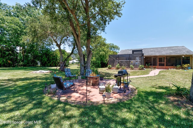 5505 95th St, Sebastian, FL 32958 - view of grassy yard featuring a patio area, a lanai, and a fire pit