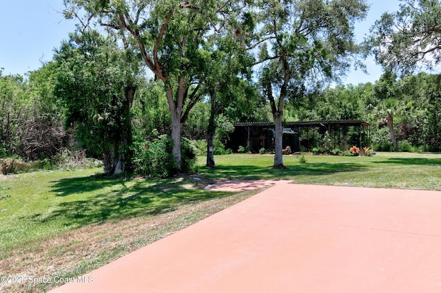 5505 95th St, Sebastian, FL 32958 - view of grassy yard featuring a patio area