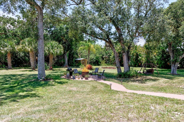 5505 95th St, Sebastian, FL 32958 - view of grassy yard featuring view of scattered trees and a shed