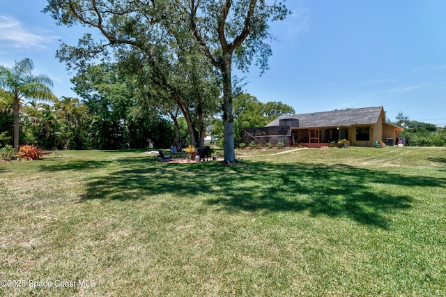 5505 95th St, Sebastian, FL 32958 - view of green lawn featuring a fire pit
