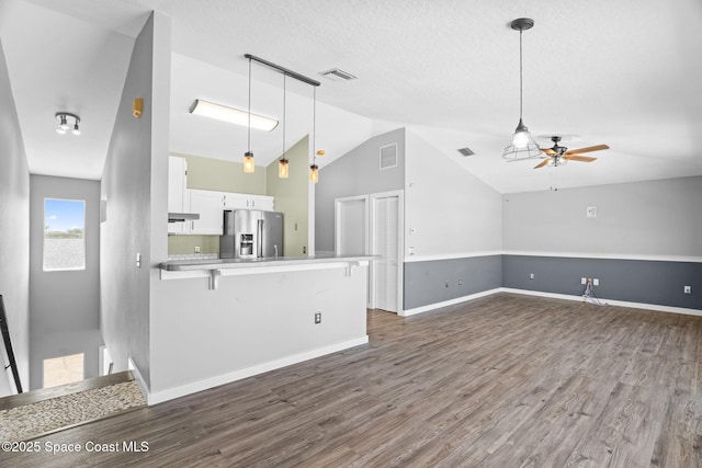 120 Norwood Ave Unit 120, Satellite Beach, FL 32937 - unfurnished living room featuring ceiling fan, vaulted ceiling, and dark wood-style flooring