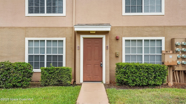 1880 Long Iron Dr Unit 1322, Rockledge, FL 32955 - view of exterior entry featuring stucco siding