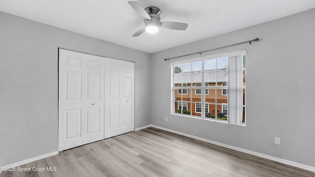 1880 Long Iron Dr Unit 1322, Rockledge, FL 32955 - unfurnished bedroom featuring wood finished floors, a closet, and a ceiling fan