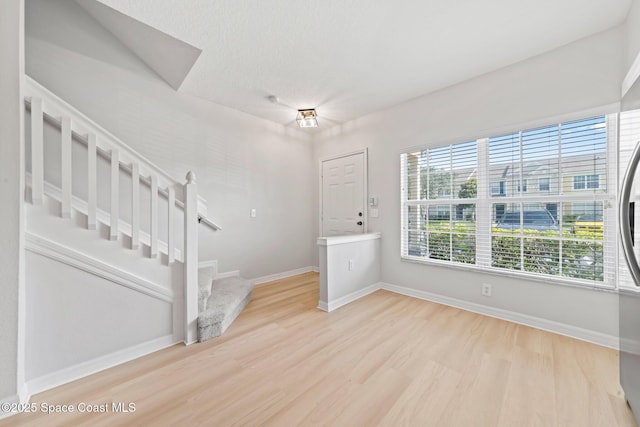 1311 Hampton Park Ln, Melbourne, FL 32940 - foyer with light wood-type flooring and stairway