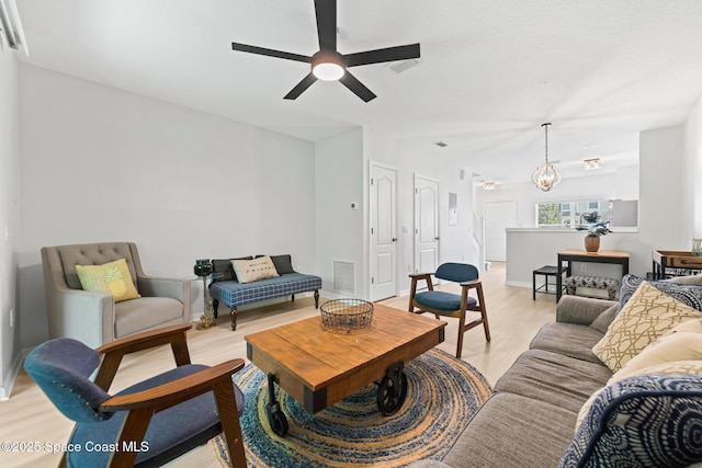 1311 Hampton Park Ln, Melbourne, FL 32940 - living room featuring a ceiling fan and light wood finished floors