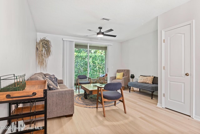 1311 Hampton Park Ln, Melbourne, FL 32940 - living room with light wood finished floors and a ceiling fan