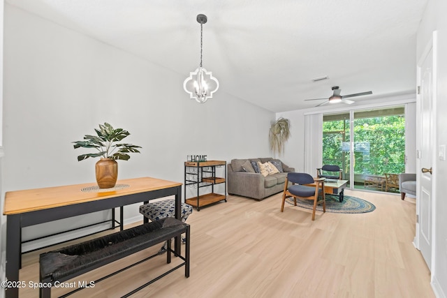 1311 Hampton Park Ln, Melbourne, FL 32940 - living area with light wood finished floors, ceiling fan, and a chandelier