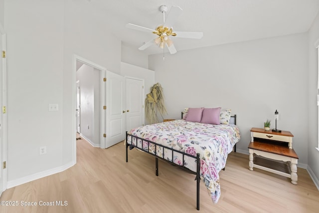 1311 Hampton Park Ln, Melbourne, FL 32940 - bedroom with light wood-style flooring, ceiling fan, and high vaulted ceiling