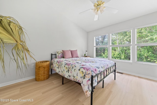 1311 Hampton Park Ln, Melbourne, FL 32940 - bedroom featuring light wood-style floors, a ceiling fan, and vaulted ceiling