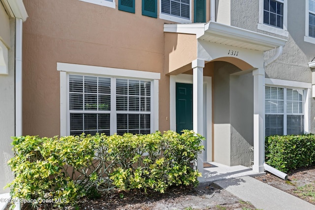 1311 Hampton Park Ln, Melbourne, FL 32940 - view of exterior entry with stucco siding