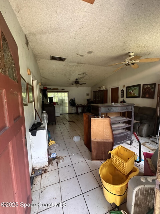 4840 Mango Ave, Cocoa, FL 32926 - interior space with ceiling fan, light tile patterned floors, and a textured ceiling