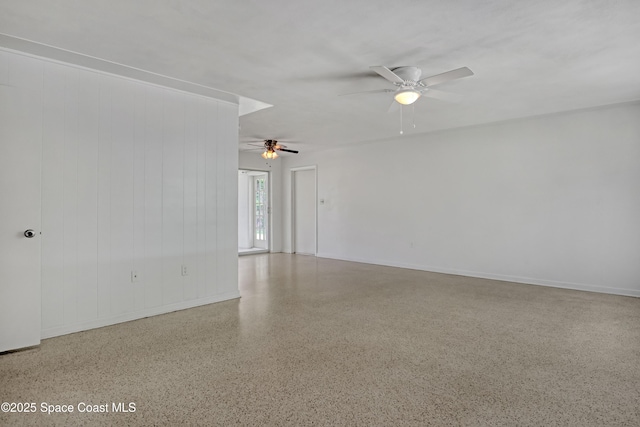 955 Samar Rd, Cocoa Beach, FL 32931 - empty room with speckled floor and a ceiling fan