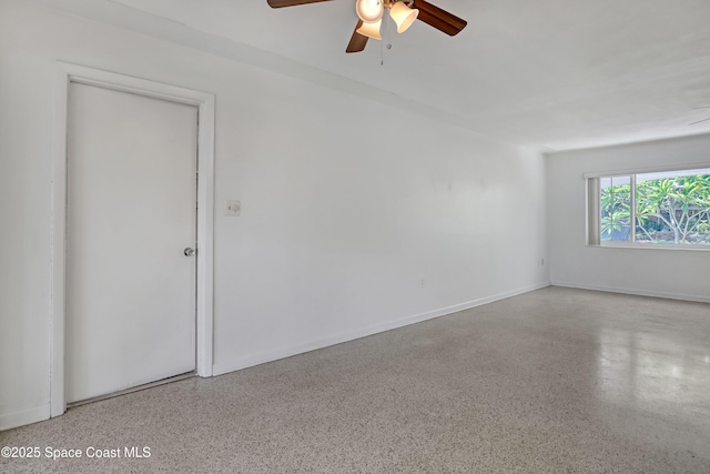 955 Samar Rd, Cocoa Beach, FL 32931 - spare room with ceiling fan and speckled floor