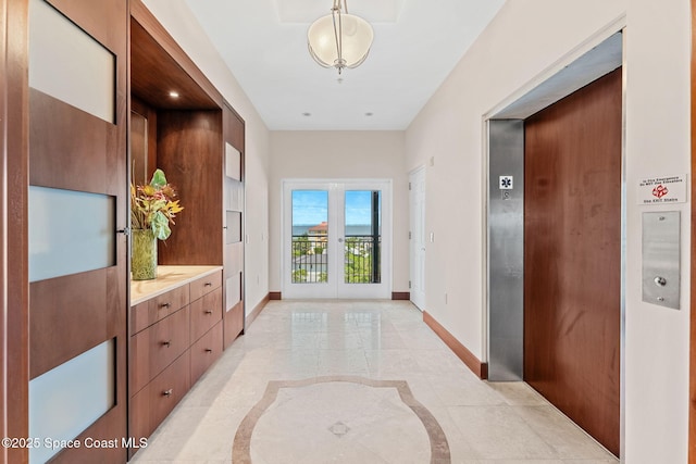 2375 S Atlantic Ave Unit 601, Cocoa Beach, FL 32931 - hall featuring inlaid floor details and elevator