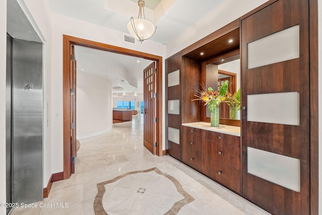 2375 S Atlantic Ave Unit 601, Cocoa Beach, FL 32931 - corridor with elevator and inlaid floor details