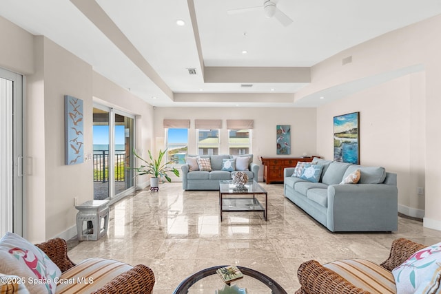 2375 S Atlantic Ave Unit 601, Cocoa Beach, FL 32931 - living room featuring a raised ceiling, light marble finish floors, ceiling fan, and recessed lighting
