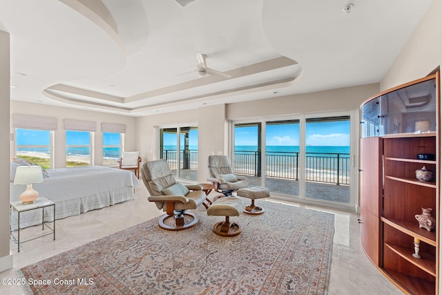 2375 S Atlantic Ave Unit 601, Cocoa Beach, FL 32931 - bedroom featuring a raised ceiling, access to outside, and a water view