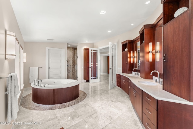 2375 S Atlantic Ave Unit 601, Cocoa Beach, FL 32931 - bathroom with a bathtub, double vanity, recessed lighting, and a stall shower