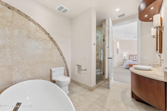 2375 S Atlantic Ave Unit 601, Cocoa Beach, FL 32931 - ensuite bathroom with a freestanding tub, a stall shower, vanity, recessed lighting, and tile patterned flooring