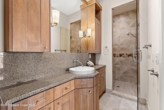 2375 S Atlantic Ave Unit 601, Cocoa Beach, FL 32931 - full bath featuring vanity, backsplash, and a shower stall