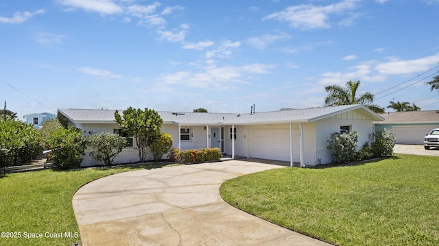1525 Tuna St, Merritt Island, FL 32952 - ranch-style home featuring a garage, a front lawn, concrete driveway, and stucco siding