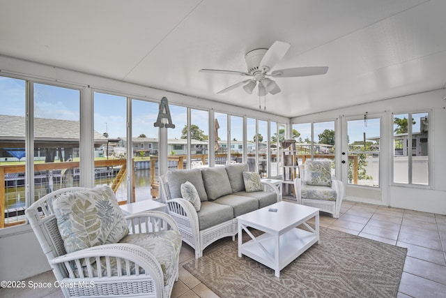 1525 Tuna St, Merritt Island, FL 32952 - sunroom with tile patterned floors, a water view, and lofted ceiling
