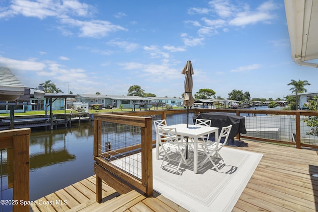 1525 Tuna St, Merritt Island, FL 32952 - dock area with outdoor dining space and a deck with water view