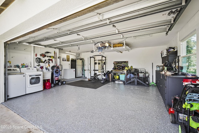 1525 Tuna St, Merritt Island, FL 32952 - garage with separate washer and dryer and freestanding refrigerator