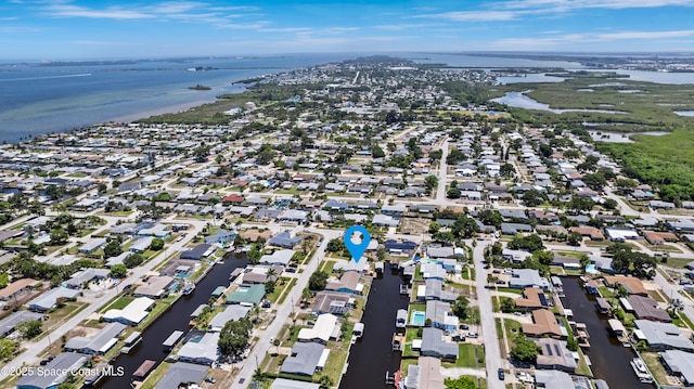 1525 Tuna St, Merritt Island, FL 32952 - aerial overview of property's location with a nearby body of water and nearby suburban area