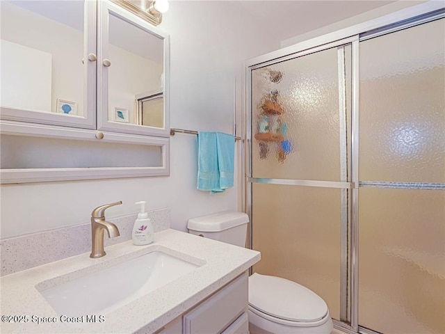 57 Woodland Dr Unit 201, Vero Beach, FL 32962 - bathroom with vanity and a shower with door