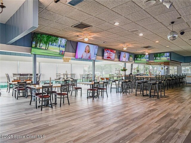 57 Woodland Dr Unit 201, Vero Beach, FL 32962 - dining area featuring wood finished floors and a ceiling fan